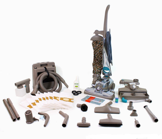 Reconditioned Kirby Sentria II upright vacuum cleaner with outer cloth bag, carpet cleaning nozzle, hose, attachments, and complete home cleaning accessories displayed together.