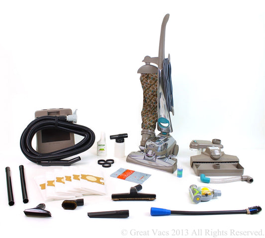 Reconditioned Kirby Sentria II upright vacuum cleaner with outer cloth bag, carpet cleaning nozzle, hose, attachments, and complete home cleaning accessories displayed together.